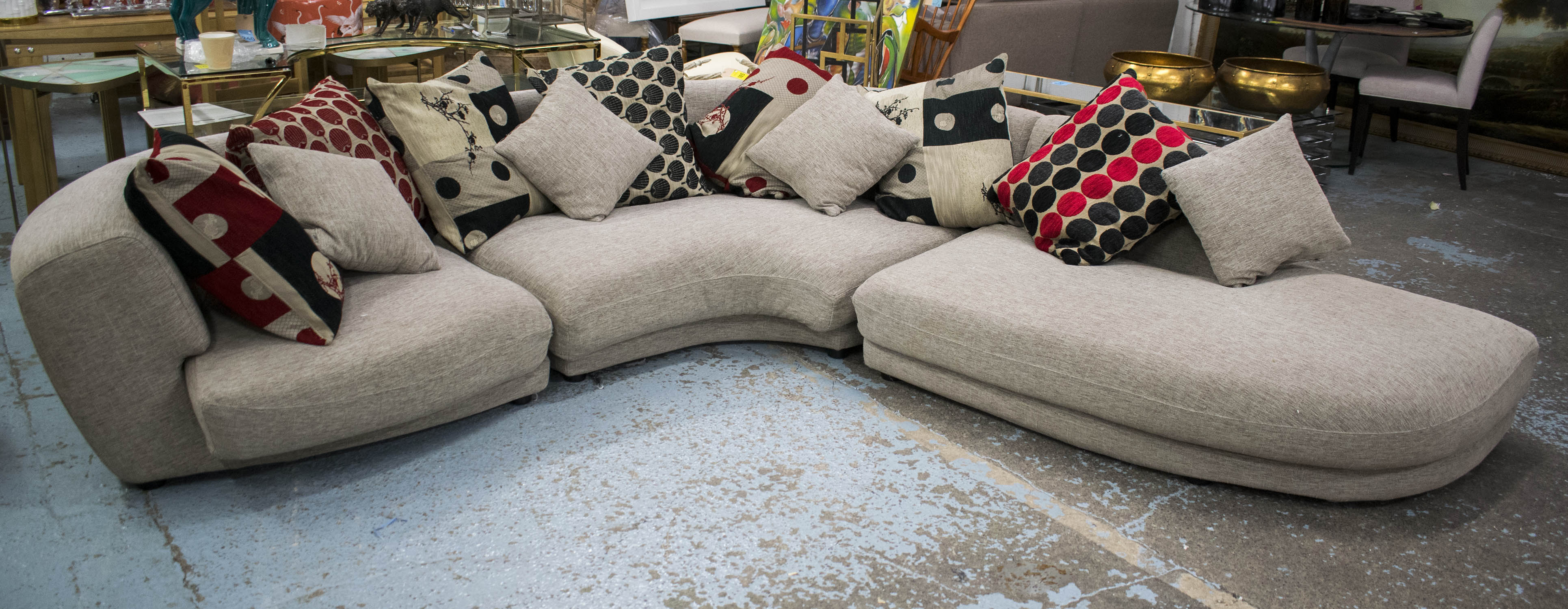 ROCHE BOBOIS CORNER SOFA, taupe fabric in three parts with eleven various scatter cushions, 66cm H x