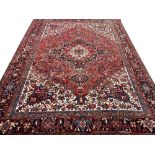 FINE PERSIAN HERIZ CARPET, 340cm x 267cm.