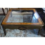 LOW TABLE, the glass top on a black lacquered Chinoiserie base with gilt detail, 107cm W x 107cm D x