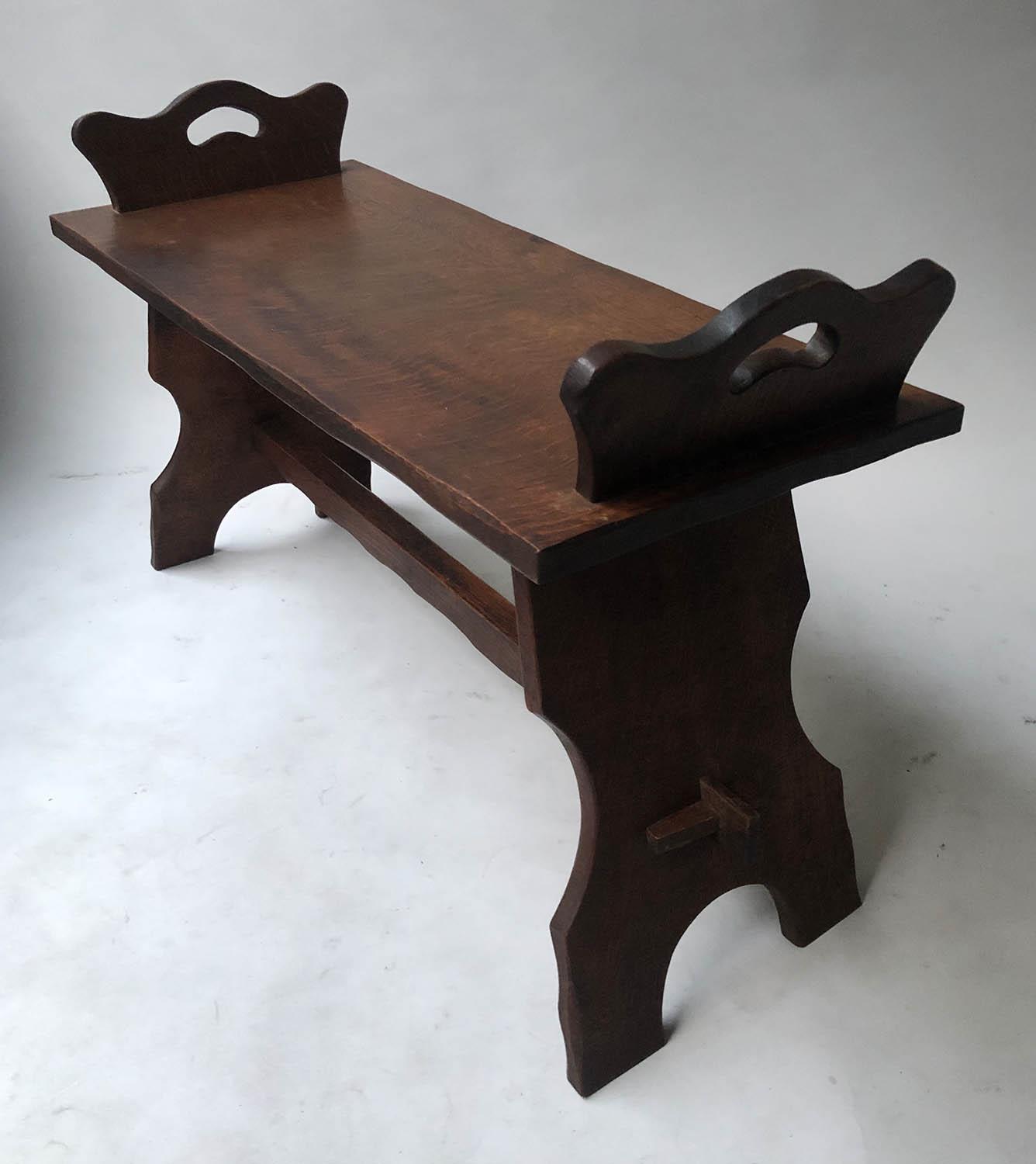 HALL BENCH, Arts and Crafts oak, rectangular with shaped handle pierced ends and trestle supports, - Image 2 of 4
