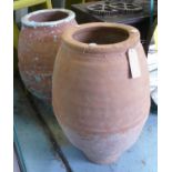 OLIVE JARS, a set of two, terracotta, one with the remnants of blue paint, 89cm at tallest. (2)