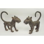 BENIN ROYAL LEOPARDS, a pair, stylised with circular fur detail, 40cm x 39cm H. (2)