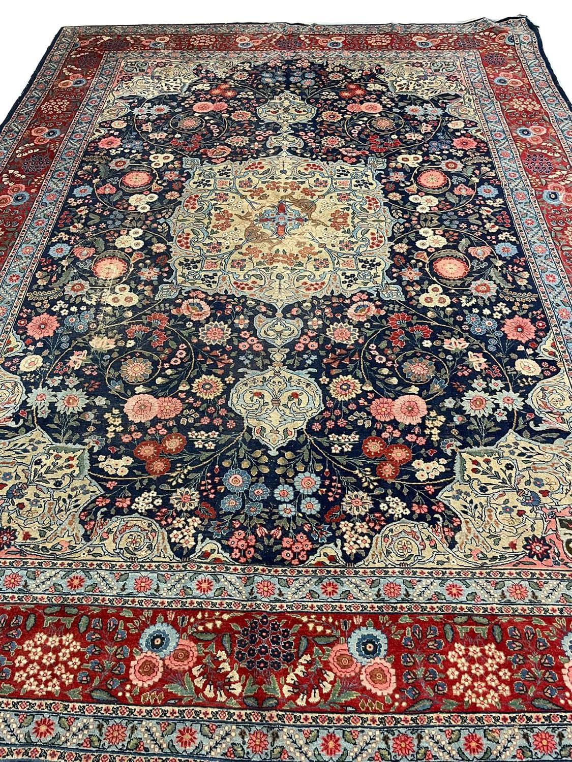 FINE ANTIQUE TABRIZ CARPET, 440cm x 335cm, dragon design pendant medallion on a millefleur field