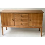 GORDON RUSSELL SIDEBOARD, 1960's walnut with three drawers and two cupboards (label to reverse)