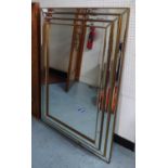 WALL MIRROR, Art Deco style stepped design, 117cm x 86.5cm.