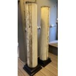 COLUMNS, a pair, 19th century fluted pine of large scale in distressed painted finish on later