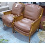 ARMCHAIRS, a pair, contemporary caned frame, leather cushions, 70cm W. (2)