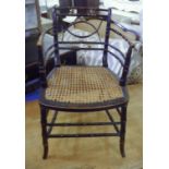 OPEN ARMCHAIR, Regency ebonised and gilt faux bamboo with a caned seat joined by stretchers, 47cm