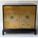 JAPANESE CABINET, 20th century gilt lacquer with two panelled doors with tree landscape on a