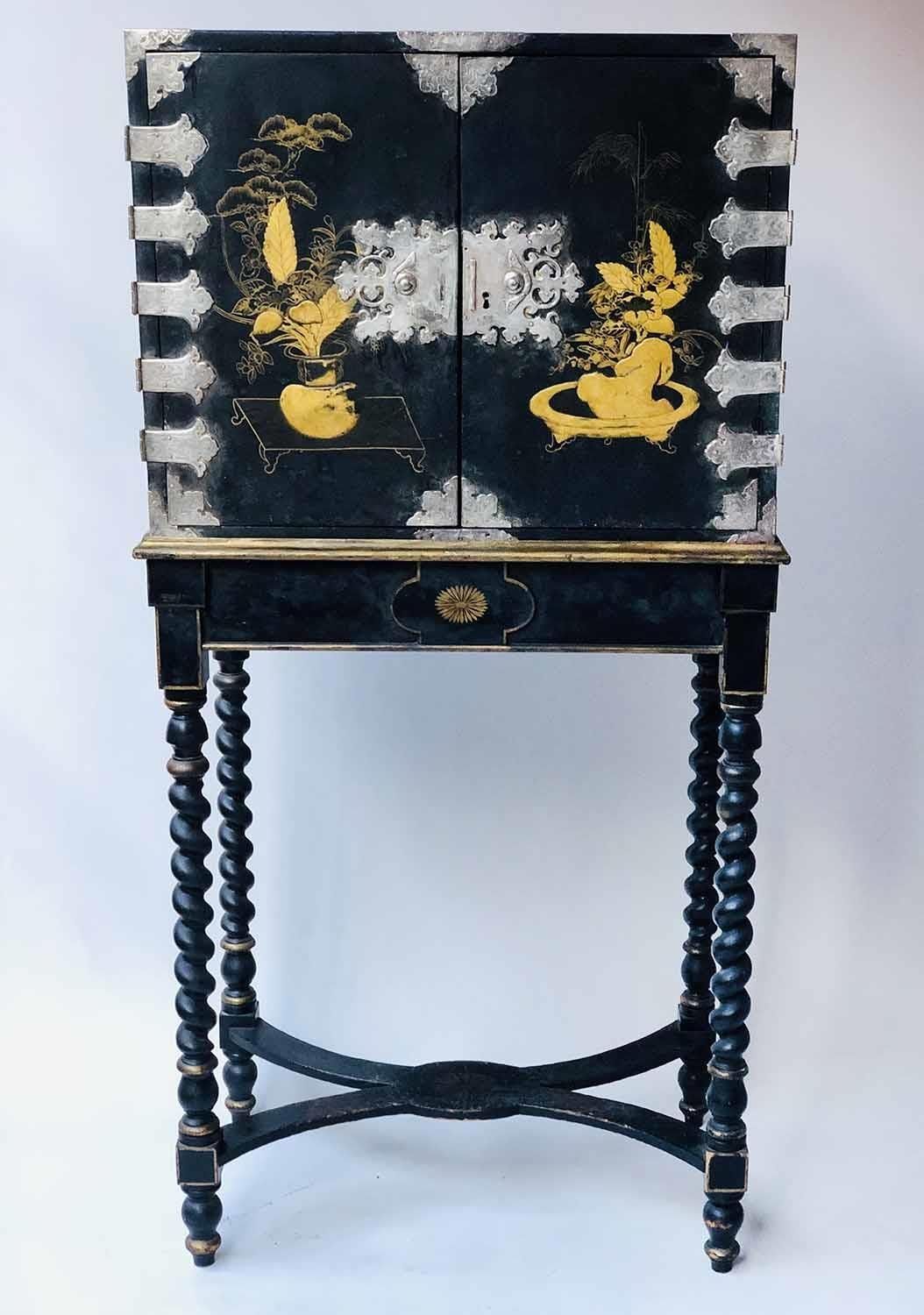 CABINET ON STAND, 18th century Chinese export decorated gilt and black lacquer with two doors
