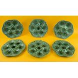 WITHDRAWN OYSTER PLATES, a set of six, by Sarreguemines France, Majolica, shaped edge in a green