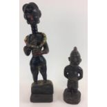 MENDE FEMALE FIGURE, Sierra Leone carved wood with an ancient hair style, painted black with