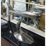 CONTEMPORARY SCHOOL, aeroplane on stand, polished metal, 41cm H.