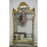 WALL MIRROR, early 20th century giltwood in George III style with scrolled detail, 102cm W x 177cm