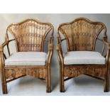 RATTAN ARMCHAIRS, a pair, mid 20th century cane bound and ranch style slatted with ticking cotton