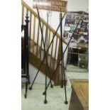 FLOOR STANDING ARROW TRIPODS, a pair, French cast iron with gilded tips, 206cm H. (2)