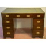 PEDESTAL DESK, military style mahogany with brass edged green leather top above nine drawers, 79cm H