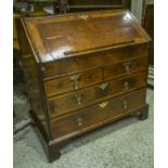 BUREAU, George I walnut and oak with fall enclosing a fitted interior with well and green baize