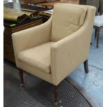 ARMCHAIR, Victorian style in oatmeal upholstery with turned front legs and brass castors, 61cm W.
