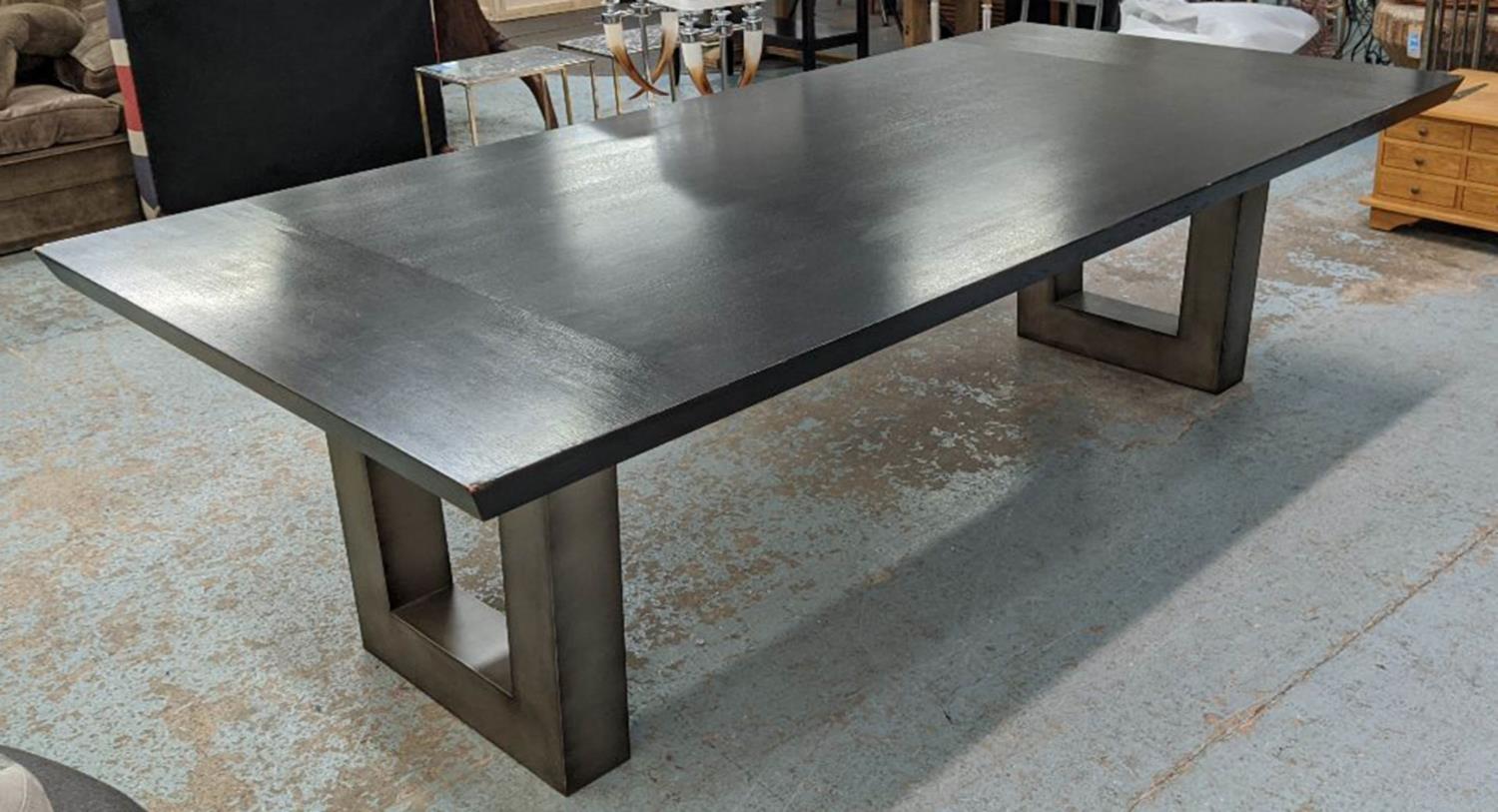 DINING TABLE, contemporary ebonised top, on steel pedestals, 275cm x 130cm x 78cm. (with faults)