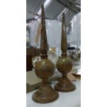 TABLE FINIALS, a pair, aged finish metal, 58cm H. (2)