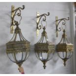 WALL HANGING CANDLE LANTERNS, a set of three, gilt metal, 70cm H x 23cm W. (3)