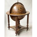 GLOBE COCKTAIL CABINET, in the form of an antique terrestrial globe on stand with rising lid and