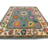 FINE CONTEMPORARY OUSHAK CARPET, 299cm x 243cm, vibrant palmette design field.