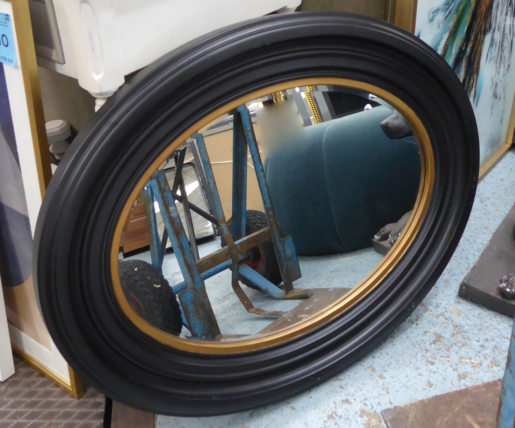 WALL MIRROR, Regency style ebonised frame with gilt accent, 86cm x 68cm.