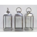 LANTERNS, a set of three, contemporary polished metal, 62cm H. (3)