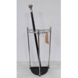STICK STAND WITH ACCOMPANYING CANE, polished metal, Victorian style, 66cm tall.