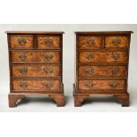 BEDSIDE CHESTS, a pair, George III style, burr walnut and crossbanded, each with five drawers,