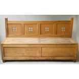 BOX SETTLE, Liberty style solid oak with pierced back and double lift seat, 183cm W x 102cm.