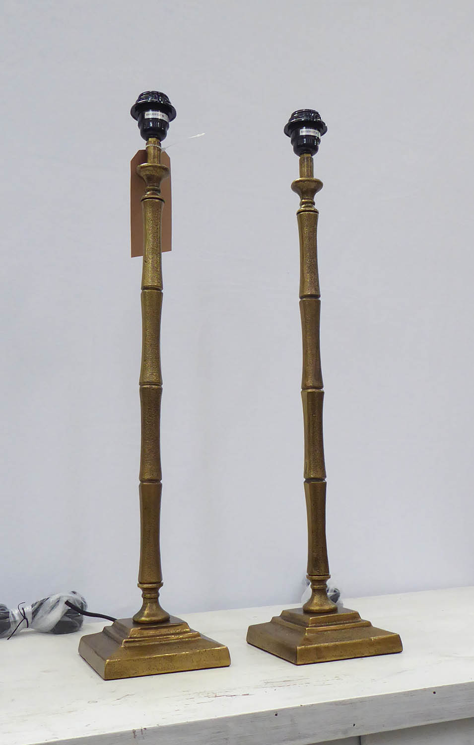 FAUX BAMBOO TABLE LAMPS, a pair, gilt metal, 68.5cm H. (2)