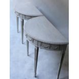 CONSOLE TABLES, a pair, George III design, Robert Adam style demi lune grey painted with ribbon swag