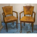 BRIDGE ARMCHAIRS, a pair, circa 1940, beechwood in original worn brown leather, 57cm W. (2) (with