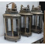 STORM LANTERNS, a set of three, antiqued gilt finish, 158cm H. (3)