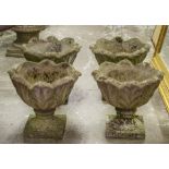 GARDEN URNS, a set of four reconstituted stone with leaf design, each 41cm H x 45cm D. (4)