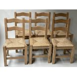 DINING CHAIRS, a set of six, English sycamore, with bar backs and rush seats, 90.5cm H. (6)