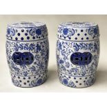 CHINESE GARDEN STOOLS, a pair, blue and white ceramic, barrel shaped and pierced, 46cm H. (2)