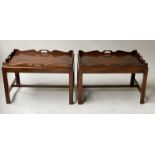 TRAY TABLES, a pair, George III design, mahogany, each rectangular handle pierced, on stands,