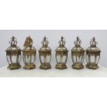 STORM LANTERNS, a set of six, gilt metal and glass, 39cm H approx. (6)
