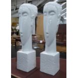 CONTEMPORARY SCHOOL BUSTS, a pair, white glazed ceramic, 61cm H. (2)