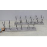 COAT RACKS, a pair, faux antler design, polished metal, 50cm L. (2)