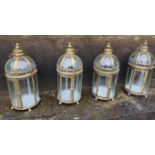 STORM LANTERNS, a set of four, gilt metal and glass, 55cm H. (4)