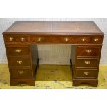 PEDESTAL DESK, Georgian style mahogany with brown leather top above eight drawers, 78cm H x 123cm