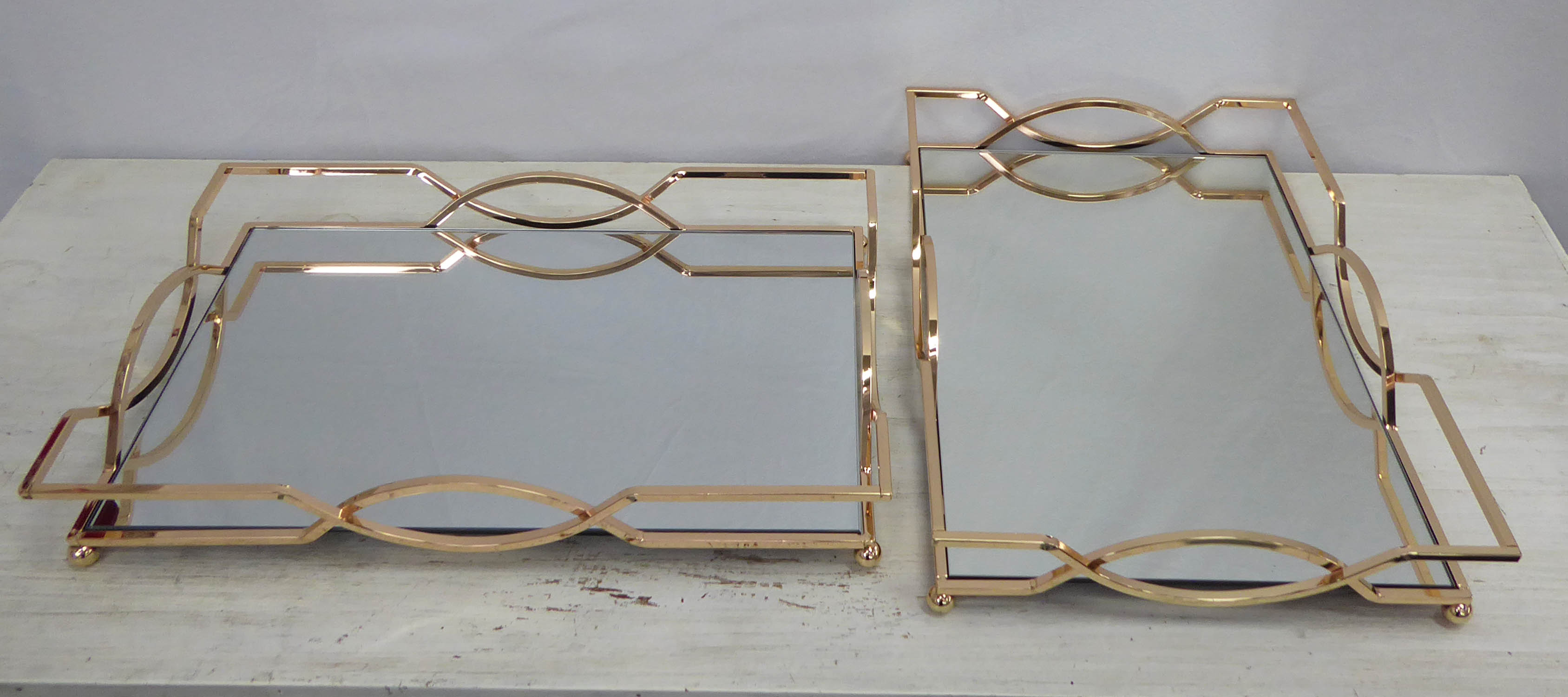 TRAYS, a pair, gilt metal and mirror, 45cm x 30cm x 7cm. (2)