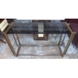 CONSOLE TABLE, the smoked glass top on a metal two tone base, 41cm D x 77cm H x 130cm W.