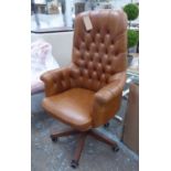 DESK CHAIR, swivel in brown leather with a high buttoned back, 126cm H x 74cm W.