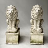 GARDEN LIONS, a pair, weathered composite stone, each rampant with plinth bases, 88cm H. (2)